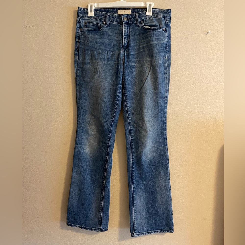 Medium wash mid rise boot cut jeans